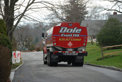 Dole Fuel Oil truck driving through Long Island neighborhood